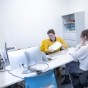 Someone providing another person a paper during counseling session