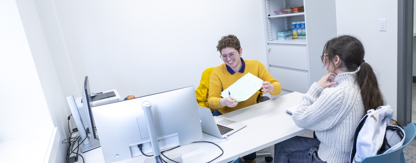 Someone providing another person a paper during counseling session