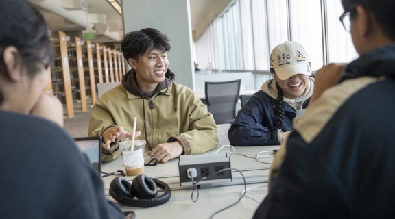 A group of students socializing in a library